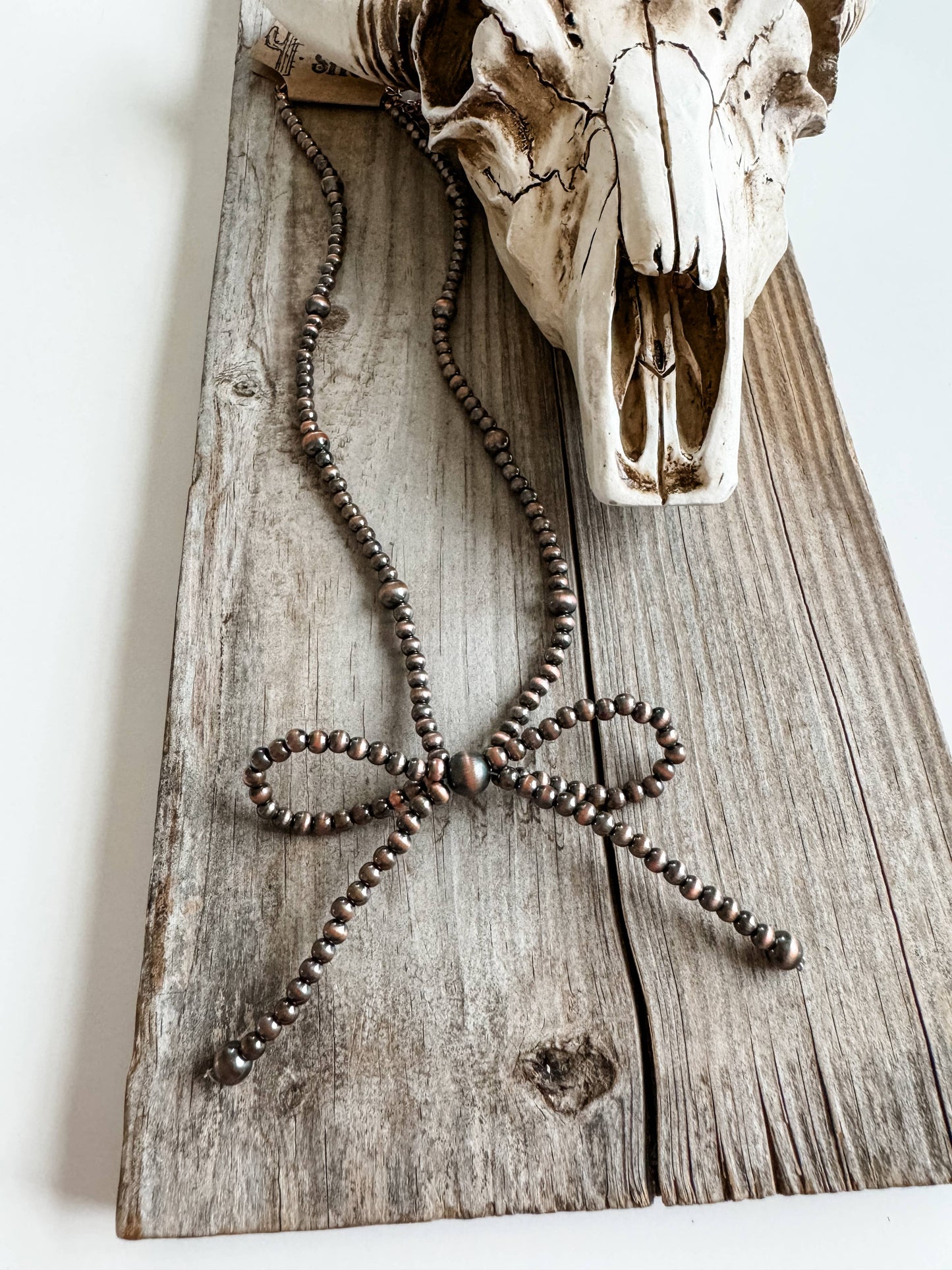 NAVAJO STYLE PEARL BOW COQUETTE NECKLACE: COPPER