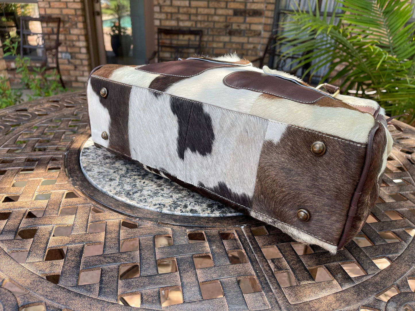 WEEKENDER DUFFLE LEATHER HAIR ON COWHIDE DUFFEL TRAVEL BAG: BROWN + WHITE COWHIDE